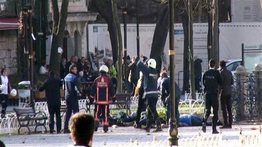 This image from video shows medics and security members with injured people lying on the ground after an explosion at Istanbul's historic Sultanahmet district, which is popular with tourists, Tuesday, Jan. 12, 2016. (IHA via AP) TURKEY OUT