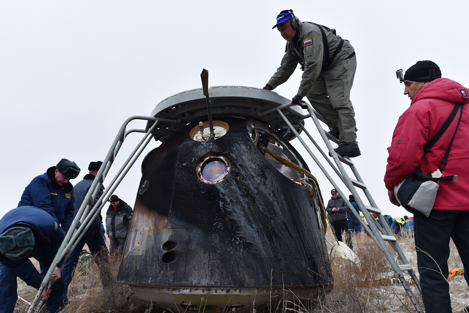 A search and rescue team works at the site of landing of the Soyuz TMA-18M space capsule carrying the International Space Station (ISS) crew of US astronaut Scott Kelly and Russian cosmonauts Mikhail Kornienko and Sergey Volkov outside the town of Dzhezkazgan, Kazakhstan, on Wednesday, March 2, 2016. US astronaut Scott Kelly and Russian cosmonaut Mikhail Kornienko returned to Earth on March 2 after spending almost a year in space in a ground-breaking experiment foreshadowing a potential manned mission to Mars. (Krill Kudryavtsev/Pool photo via AP)