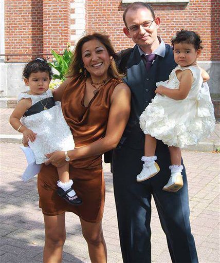 In this Aug. 20, 2013 photo, from the personal Facebook page of Adelma Tapia Ruiz and provided by her brother Fernando Tapia Ruiz, shows Ruiz with her Belgian husband Christophe Delcambe, and their twin daughters Maureen and Alondra. (AP Photo)