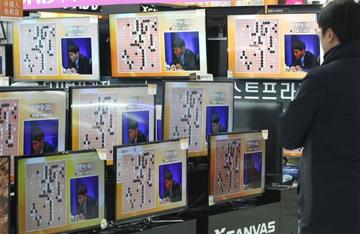 South Korean professional Go player Lee Sedol is seen on the TV screens during the Google DeepMind Challenge Match against Google's artificial intelligence program, AlphaGo, at the Yongsan Electronic store in Seoul, South Korea, Wednesday. (AP Photo/Ahn Young-joon)