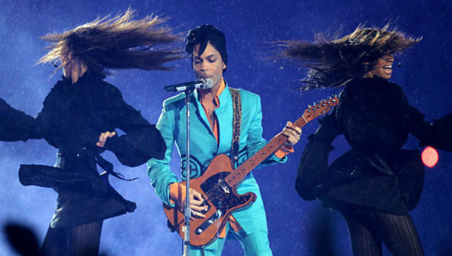 Prince performs in the rain at the 2007 Super Bowl halftime show.