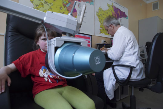 A pediatrician performs yearly check for radioactive elements of Oksana Zabeylo.