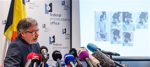 Belgian Federal Prosecutor Eric Van Der Sypt addresses the media during a press conference in Brussels on Thursday April 7, 2016. The Federal Prosecutor's Office and the Examining Magistrate in Brussels made available new CCTV footage and stills of the third suspect of the recent terrorists attack at Brussels airport during his escape from the airport after the blasts. (AP Photo/Geert Vanden Wijngaert)