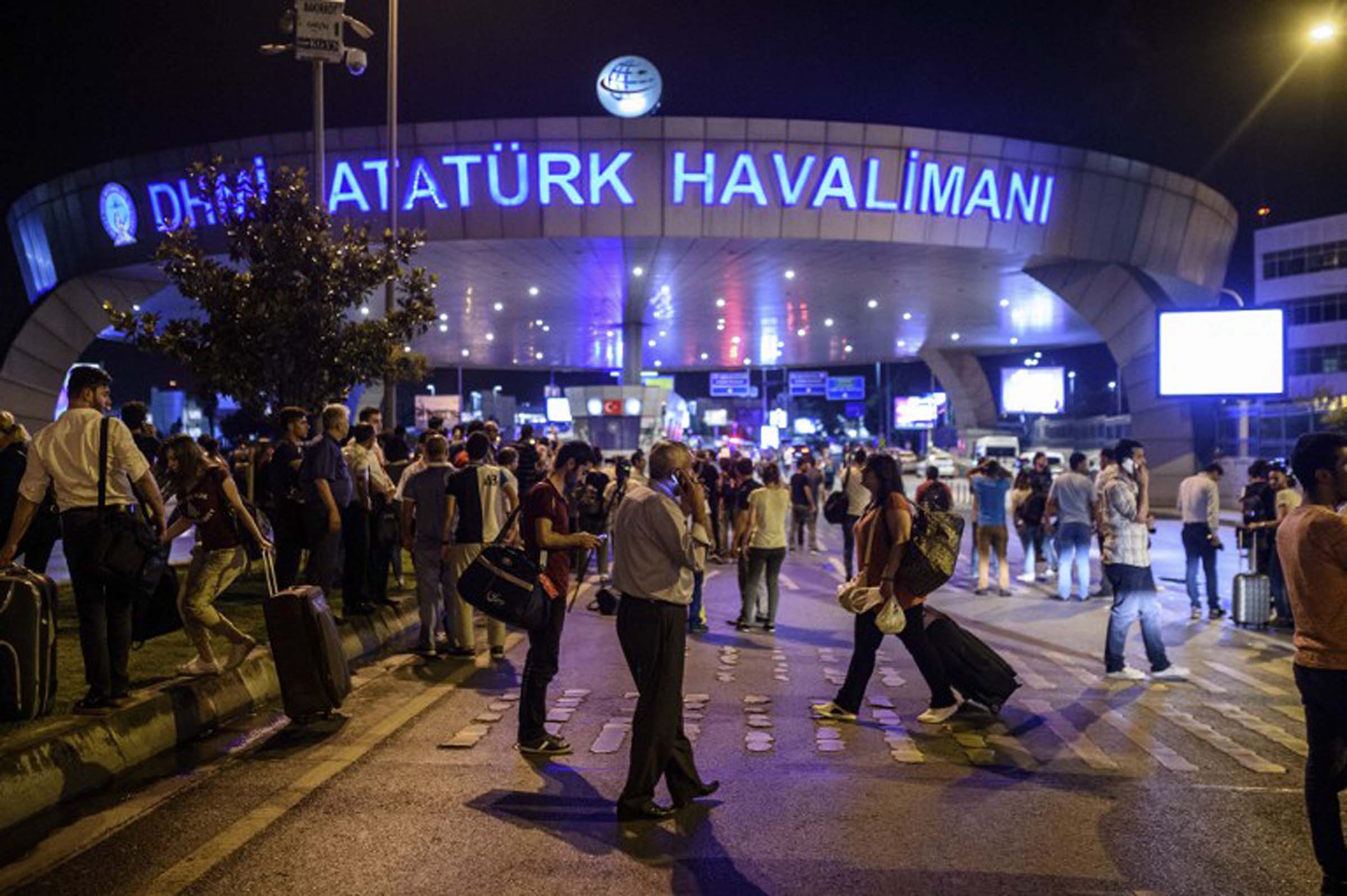 People leave the Istanbul airport after attacks