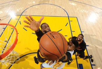 the Golden State Warriors shoots a lay up against LeBron James