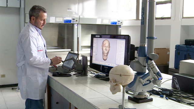 Morphology official examining computer reconstruction.