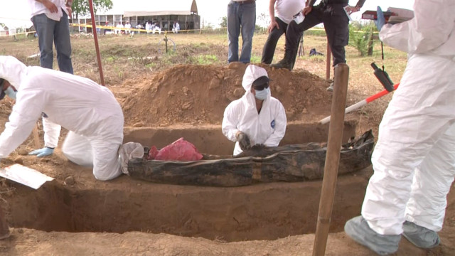 a Colombian CSI working on exhumation of Unidentified bodies.