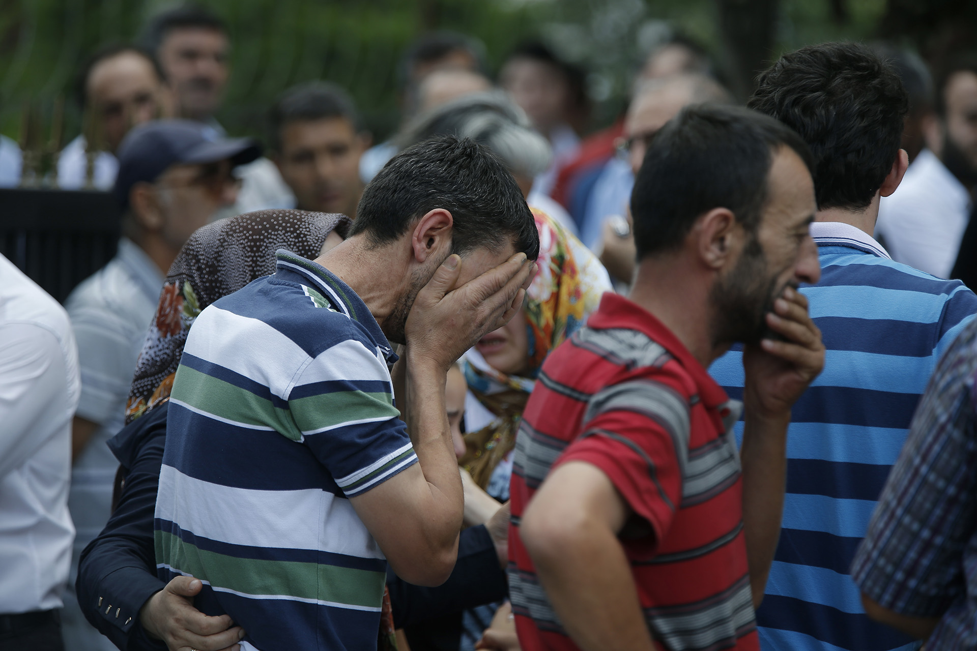 Family members of victims cry outside the Forensic Medical Center in Istanbul, Wednesday, June 29, 2016. Turkish authorities have banned distribution of images relating to the Ataturk airport attack within Turkey.(AP Photo/Emrah Gurel)