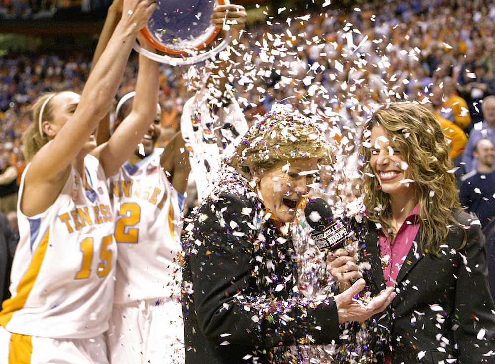 Tennessee coach Pat Summitt has confetti dumped on her by players Alicia Manning (15) and Alex Fuller (2) after the Lady Vols defeated Georgia 73-43 in an NCAA college basketball game in Knoxville, Tenn., earning Summitt her 1,000th career coaching victory on Feb. 5, 2009. (AP Photo/Wade Payne)