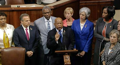 In this frame grab taken from AP video Georgia Rep. John Lewis leads more than 200 Democrats in demanding a vote on measures to expand background checks and block gun purchases by some suspected terrorists in the aftermath of last week's massacre in Orlando. (AP Photo)