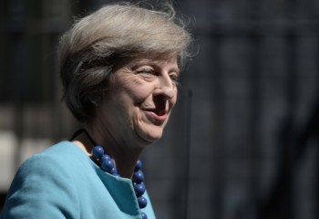 Theresa May came under immediate pressure on July 14 on her first full day as Britain's new prime minister after a series of surprise appointments to her cabinet, including the gaffe-prone Boris Johnson as foreign minister.