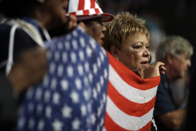 Florida delegates hold up a flag