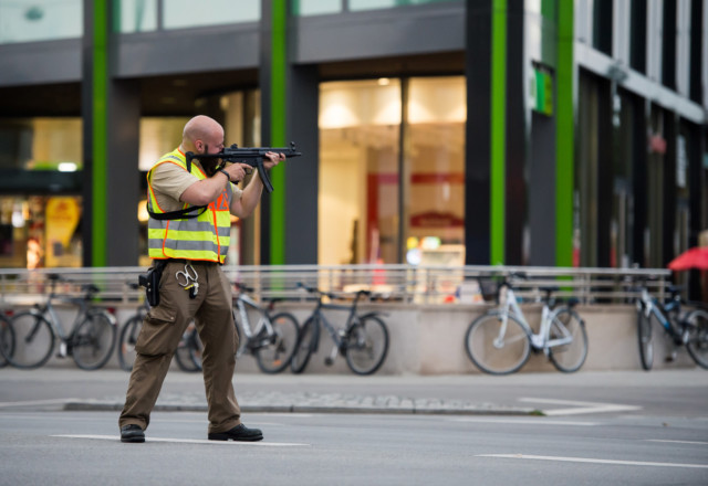 Officer secures mall in Munich following shooting