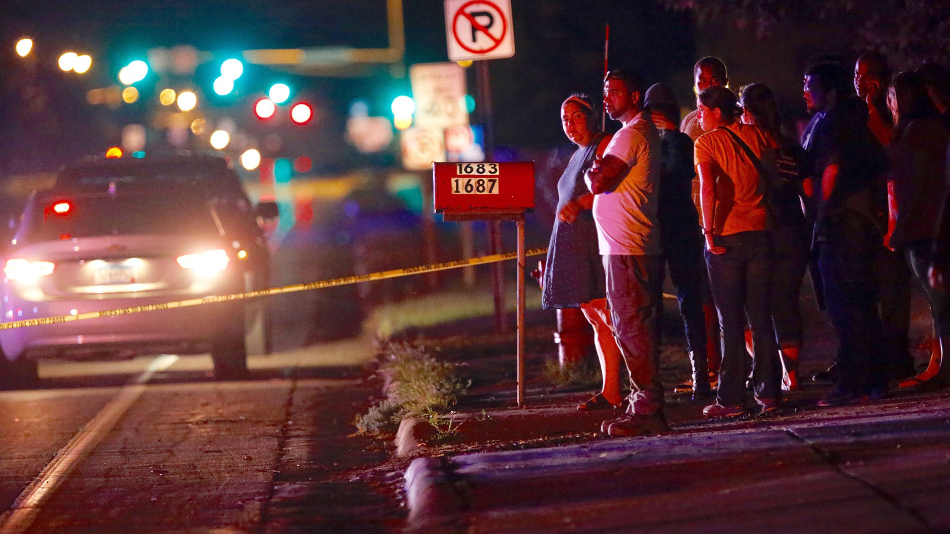 A crowd gathers at the scene of a shooting of a man involving a St. Anthony Police officer on Wednesday, July 6, 2016, in Falcon Heights, Minn. (Leila Navidi/Star Tribune via AP)
