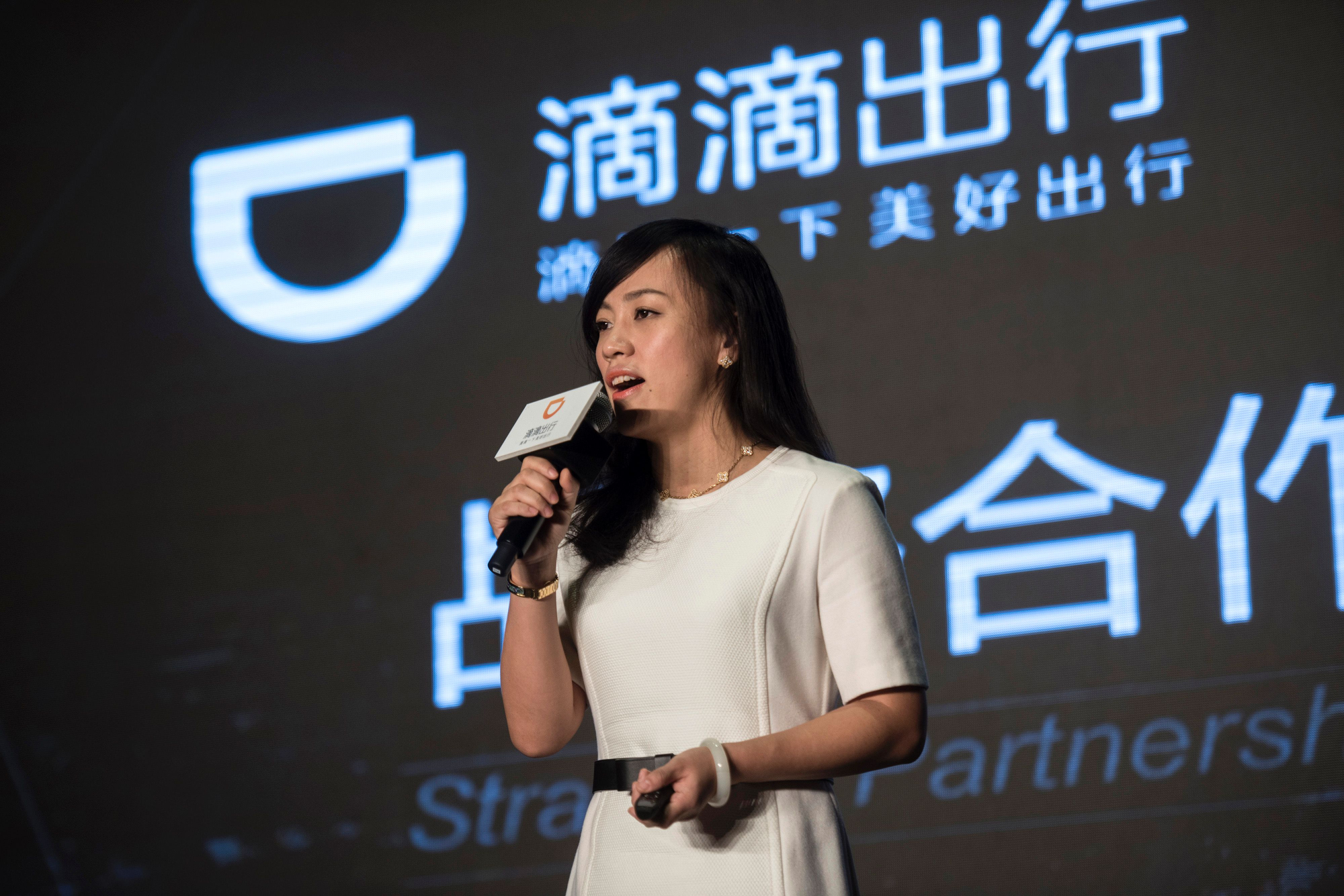 (FILES) This file picture taken on January 26, 2016 shows Jean Liu, president of Didi Chuxing, the number one ride-sharing and taxi-hailing service in China, attending a press event in Beijing. Ride-sharing giant Uber is to merge its China operations with local rival Didi Chuxing, reports said on August 1, ending a ferocious battle for market share in the world's second-largest economy. / AFP PHOTO / FRED DUFOUR