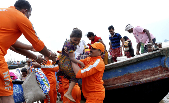 rescuers place young girl on boat