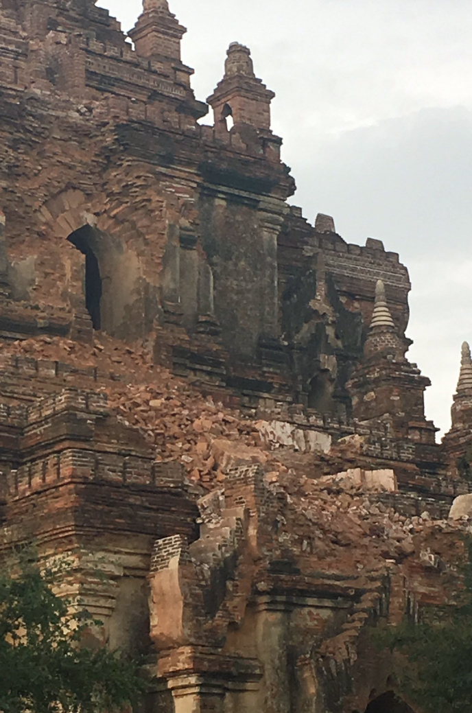 This photo provided by David Greco/@daveinosaka, shows a damaged temple in Bagan, Myanmar, on Wednesday, Aug. 24, 2016. A powerful earthquake measuring a magnitude 6.8 shook central Myanmar on Wednesday, damaging scores of ancient Buddhist pagodas in the former capital of Bagan, a major tourist attraction, officials said. (David Greco/@daveinosaka via AP)