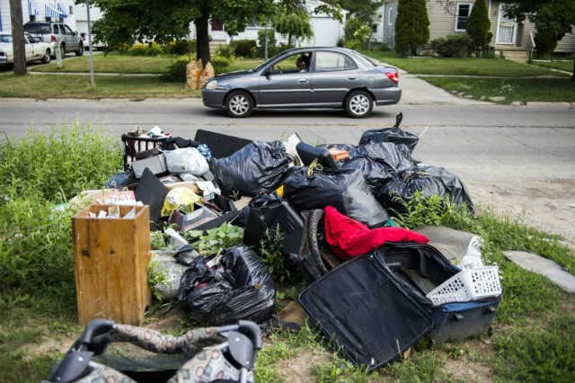 Trash piles up on Dupont Street. (Jake May | MLive.com)
