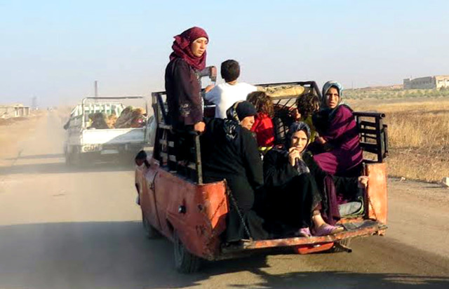 civilians leaving the town on truck