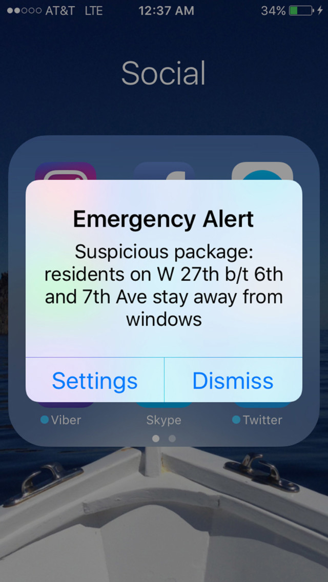 An Emergency Alert appears on a mobile phone concerning a suspicious package on West 27th Street between 6th and 7th Avenues, early Sunday morning, Sept. 18, 2016. (AP Photo/Maria Sanminiatelli)