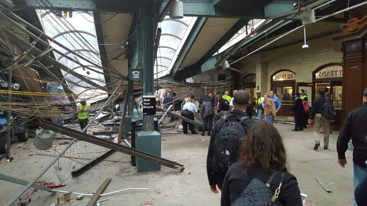 This photo provided by Ian Samuel shows the scene of a train crash in Hoboken, N.J., on Thursday, Sept. 29, 2016. A commuter train barreled into the New Jersey rail station during the Thursday morning rush hour, causing serious damage. The train came to a halt in a covered area between the station's indoor waiting area and the platform. A metal structure covering the area collapsed. ( Twitter User @Cephster via AP)