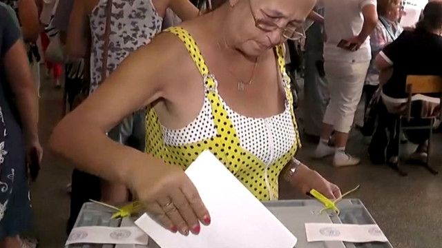 Woman placing her ballot