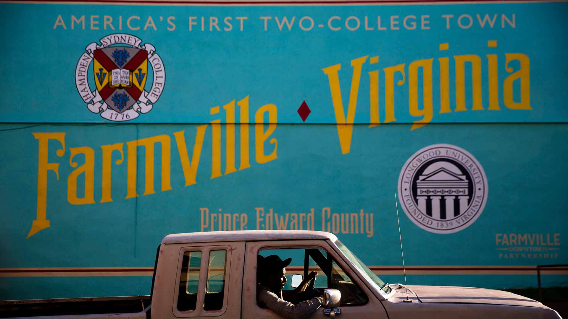 A mural decorates a building as a motorist passes through historic Farmville, Va., Sunday, Oct. 2, 2016. With the first presidential debate complete and its spin cycle nearly over, the two understudies are getting ready to take the main stage. AP Photo/David Goldman)