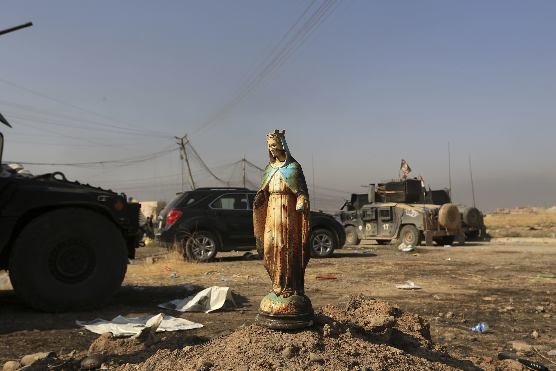A statue of Virgin Mary is placed in a street in Bartella, Iraq, Sunday, Oct. 23, 2016. Iraqi forces captured Bartella, around 15 kilometers (9 miles) east of Mosul. (AP Photo/Khalid Mohammed)