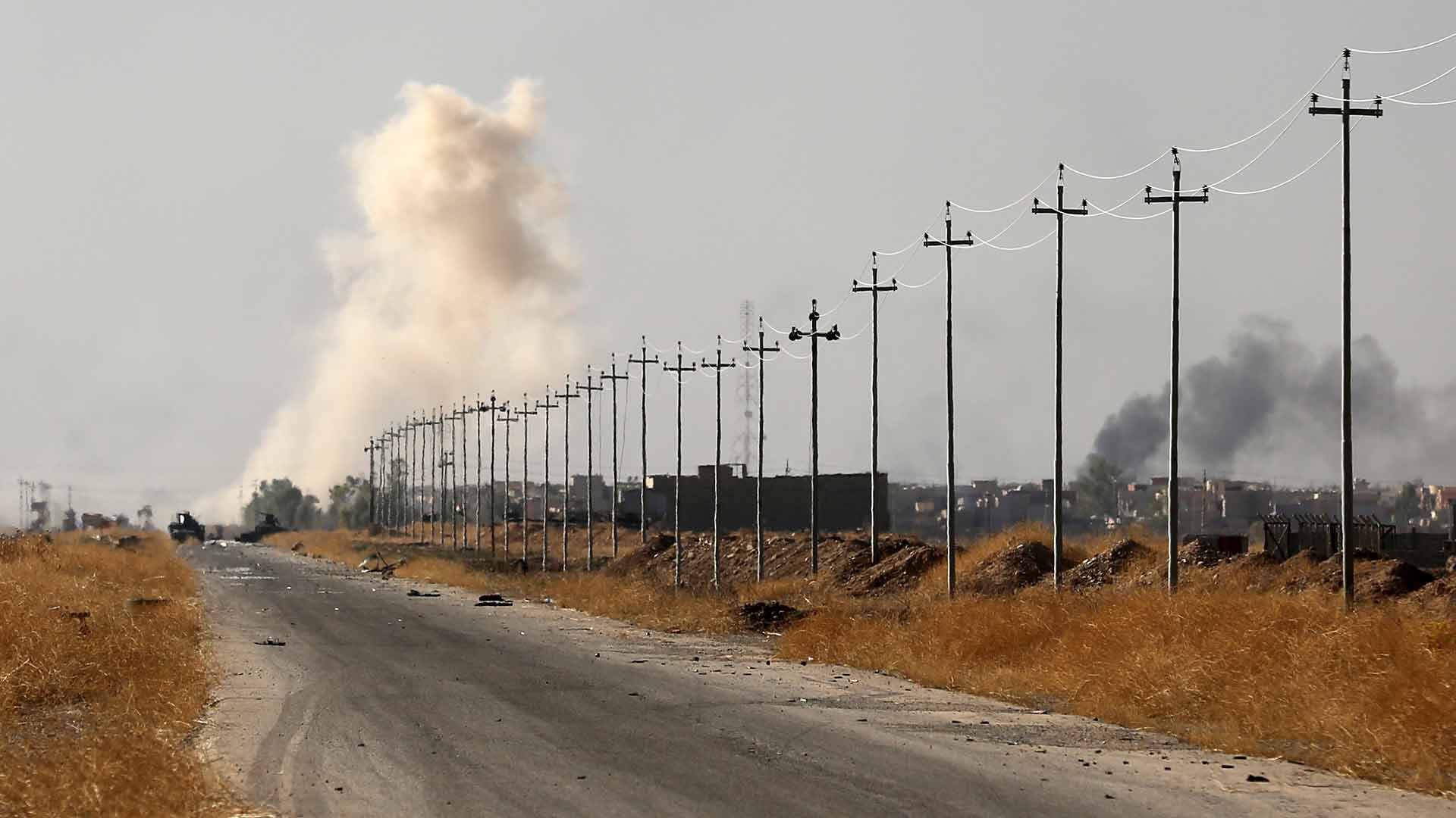 Smoke rises in nearby Mosul as Iraq's elite counterterrorism forces advance towards the city, Iraq, Thursday, Oct. 20, 2016. In a significant escalation of the battle for Mosul, elite Iraqi special forces joined the fight Thursday, unleashing a pre-dawn assault on an Islamic State-held town east of the besieged city. (AP Photo/Khalid Mohammed)