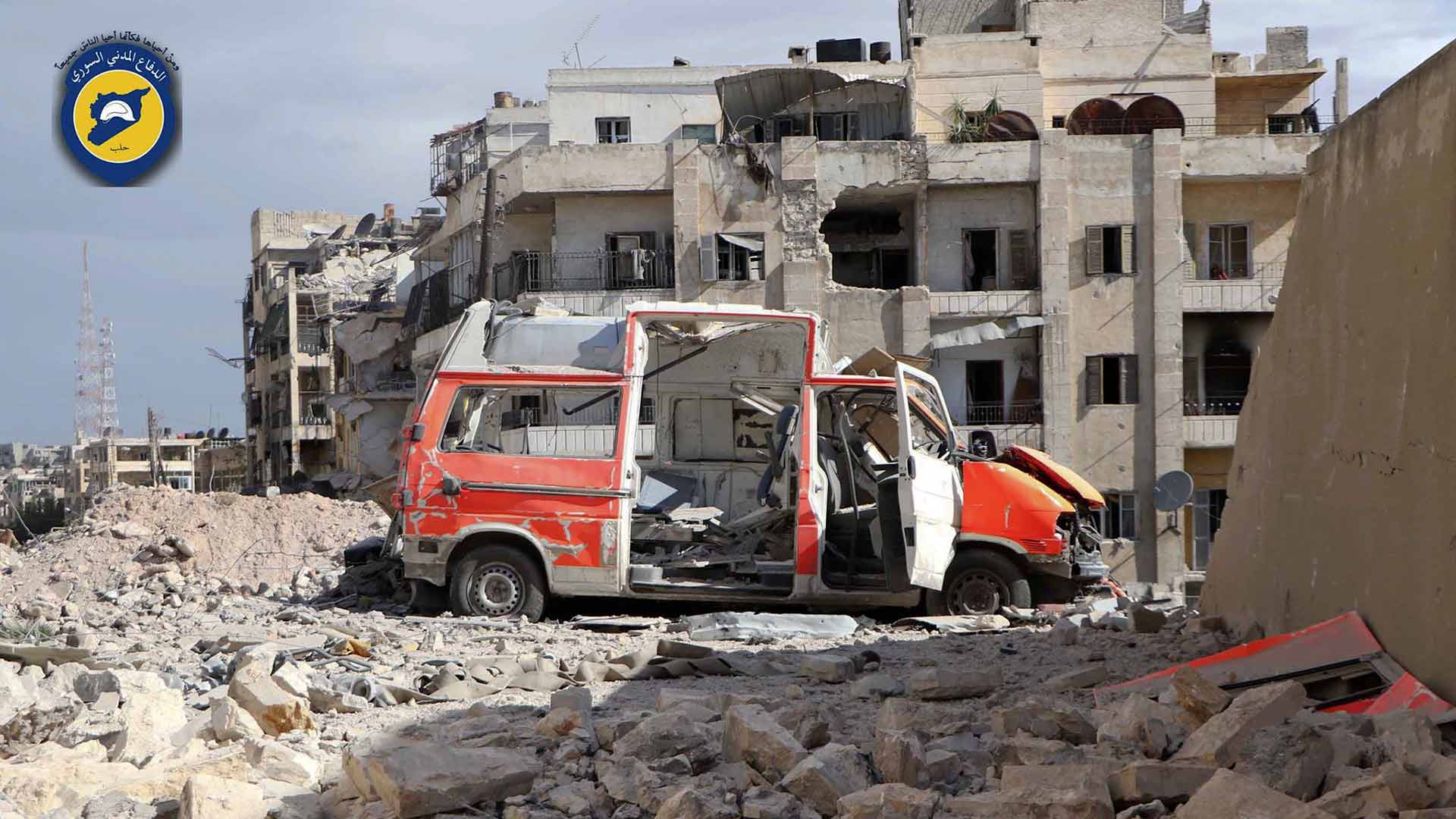In this photo provided by the Syrian Civil Defense group known as the White Helmets, taken Sept. 23, 2016, a destroyed ambulance is seen outside the Syrian Civil Defense main center after airstrikes in Ansari neighborhood in the rebel-held part of eastern Aleppo, Syria. (Syrian Civil Defense White Helmets via AP)