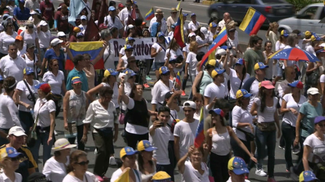 Venezuelan women march in protest following suspension of recall referendum against President Maduro