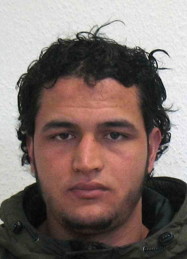 The wanted photo issued by German federal police on Wednesday, Dec. 21, 2016 shows 24-year-old Tunisian Anis Amri who is suspected of being involved in the fatal attack on the Christmas market in Berlin on Dec. 19, 2016. German authorities are offering a reward of up to 100,000 euros ($105,000) for the arrest of the Tunisian. (German police via AP)
