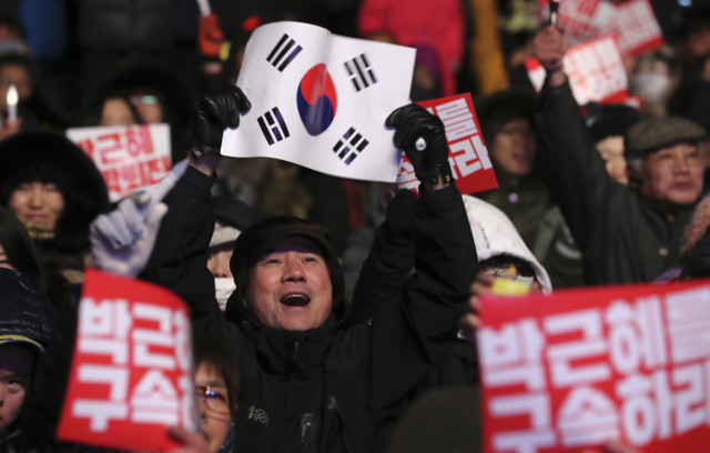 South Koreans react after President Park's impeachment