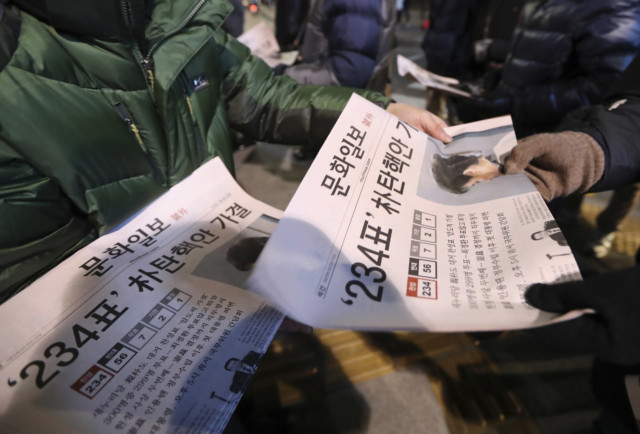 South Koreans react after impeachment of President Park