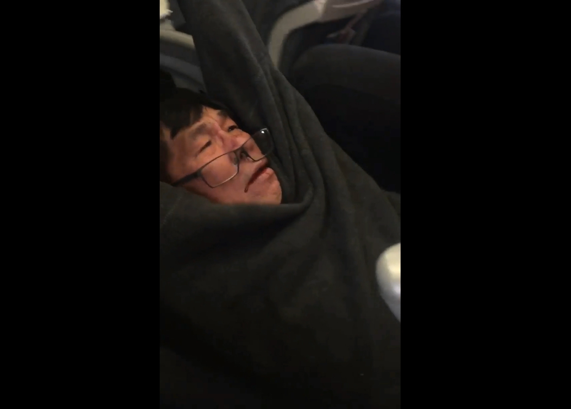 VIDEO: Passenger dragged off overbooked United plane