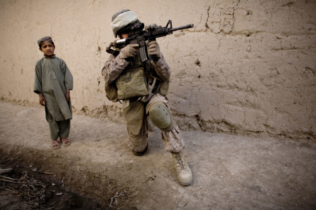 Afghan boy and US soldier