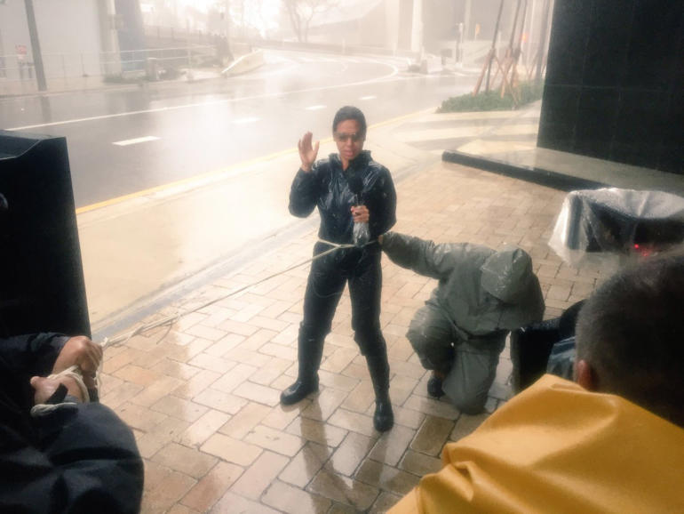 CGTN's Nitza Soledad is literally tied down as she reports on Irma's 120+ mph winds in Miami, Fla.