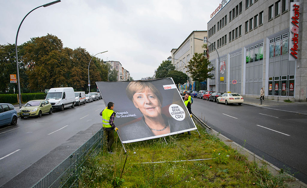 Merkel faces tough task finding coalition partners in divided Germany