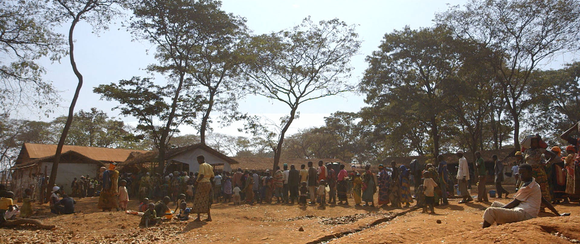 Refugees line up to be registered as camp residents.