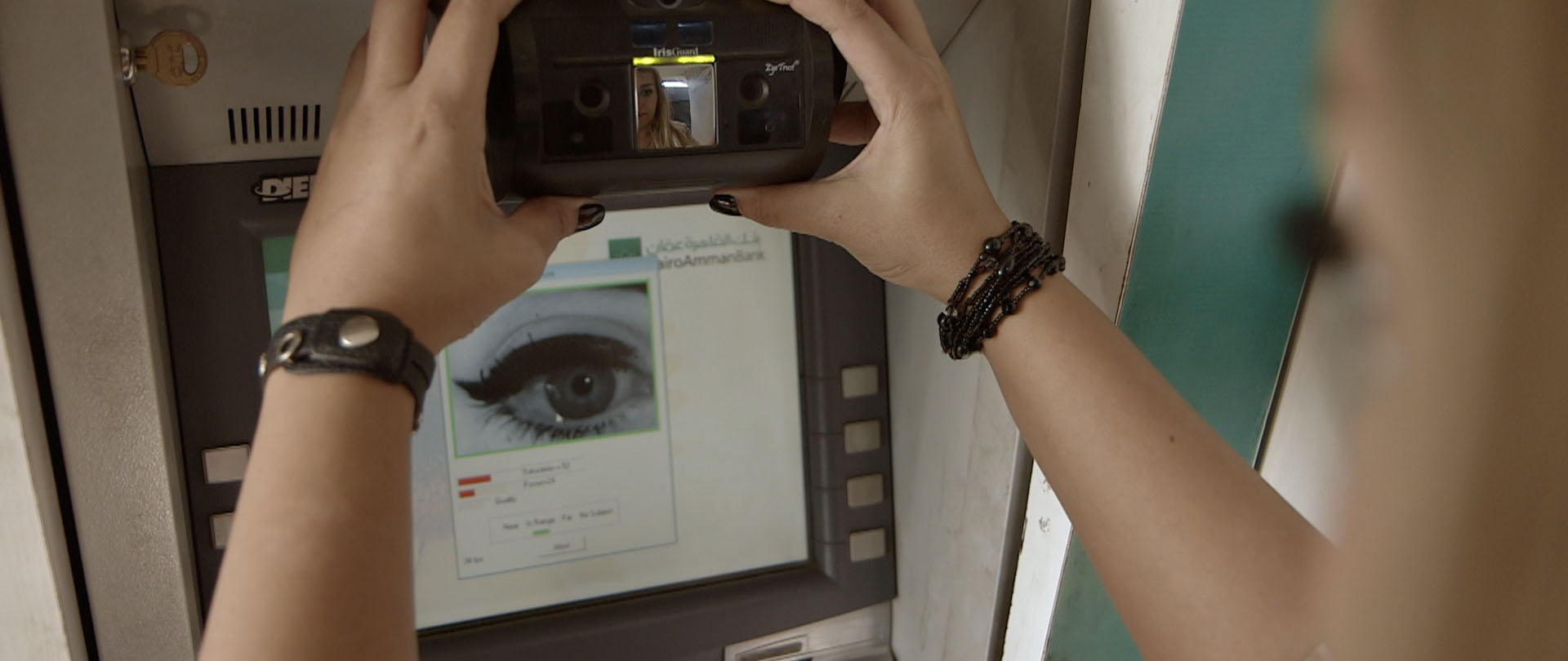 Iris scanning biometrics allow refugees in camps to safely retrieve cash disbursements from automatic tellers.