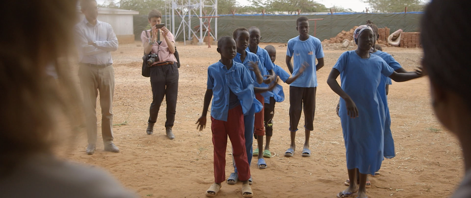 In Dadaab, the world’s largest camp, schoolchildren perform a dance for a visiting Swedish dignitary. 