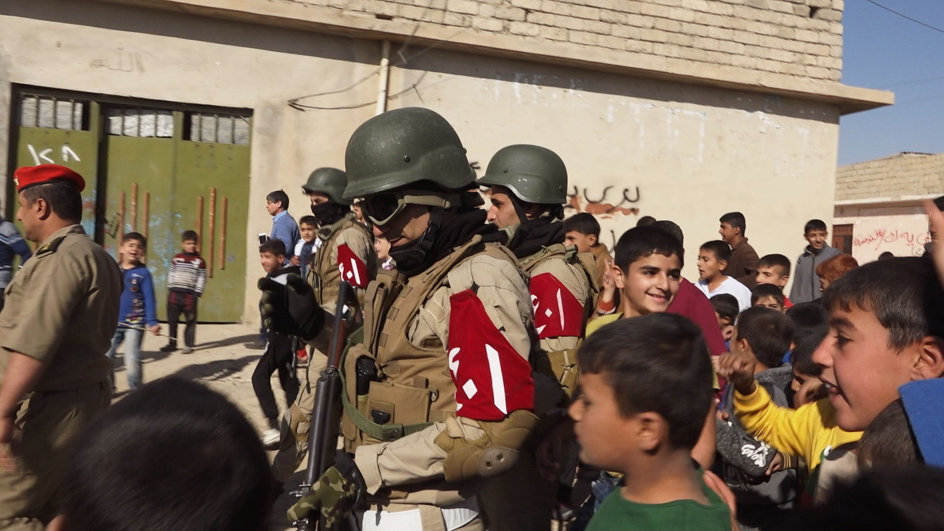 In Fazliya, children show gratitude towards their town’s recent liberators.