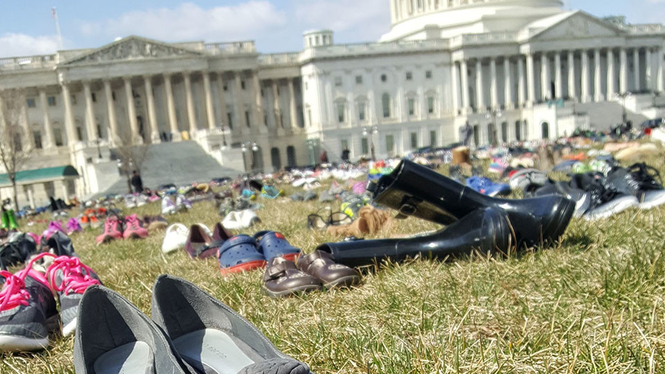 Shoes representing 7,000 victims of gun violence displayed on Capitol lawn