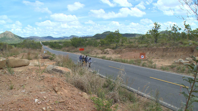 Venzuelan migrants plod along highway 174 on their way from the border town of Pacaraima to Boa Vista