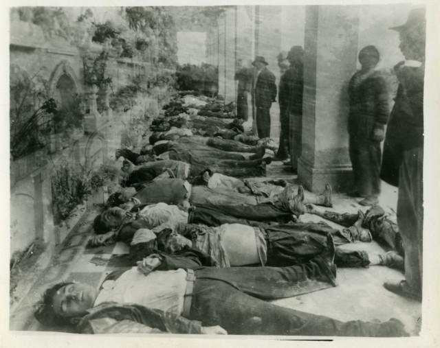 The dead are laid out in Cementerio Central after the riots