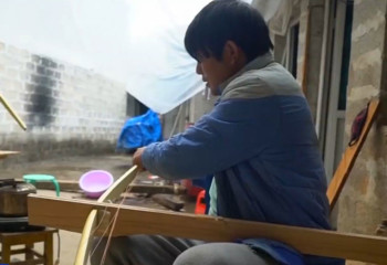 Chinese crossbow shooters and wood turners try to preserve ethnic traditions