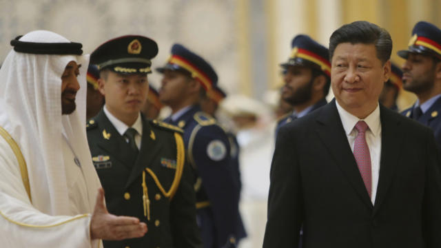 Prince of Abu Dhabi, left, gestures to Chinese President Xi Jinping