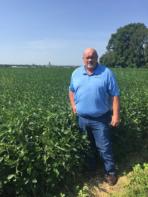 Farmer Harry Thompson stands in a field of soybeans near Jefferson City, MO
