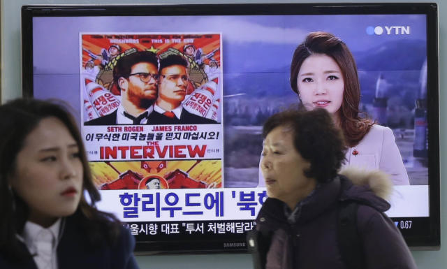 a TV screen showing a poster of Sony Picture's "The Interview"