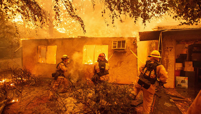 Wildfires stretch across more than 100 square miles of Southern California